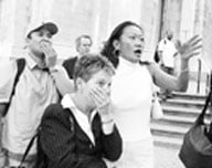 New Yorkers watching the second tower fall. ()