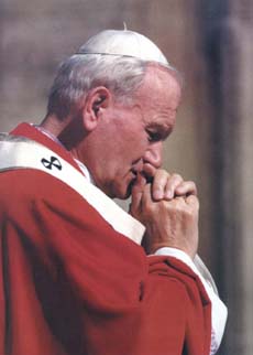 Pope John Paul II in prayer ()