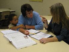 Melissa Daniel (right) tutors in the newly named Learning Commons. (Landry Haarmann)