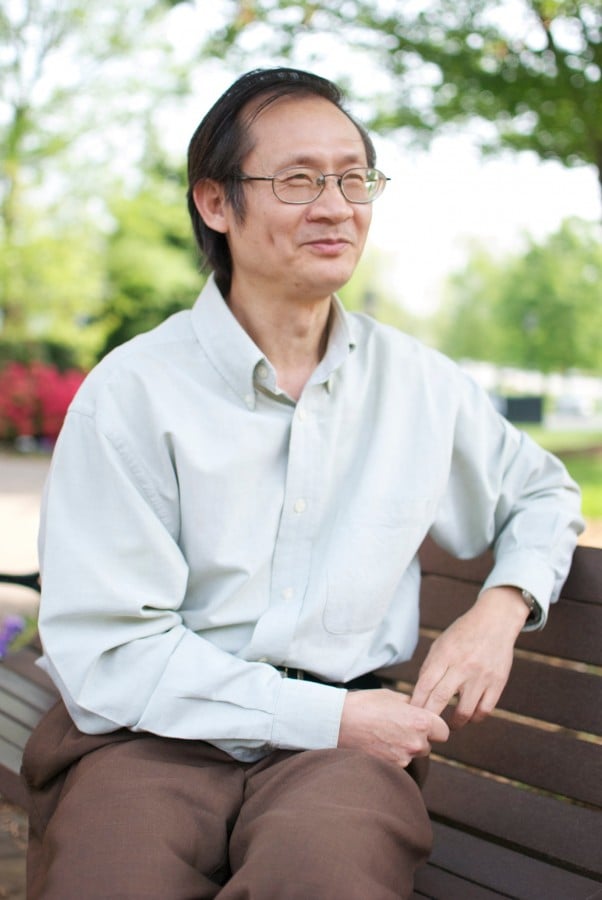 George Guo, associate professor of political science, enjoys a spring day at Guilford.  (Taylor Shields )