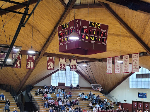 The most intense part of the game is watching the scoreboard hanging from above in Guilford’s gym.