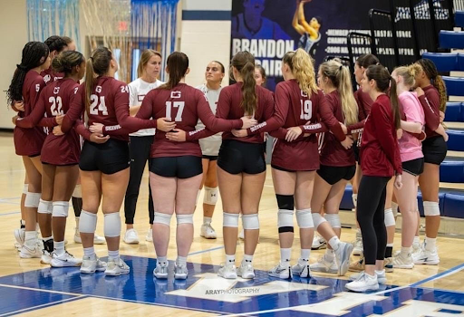 Coach Goodman shares her wisdom with the women’s volleyball team. 
